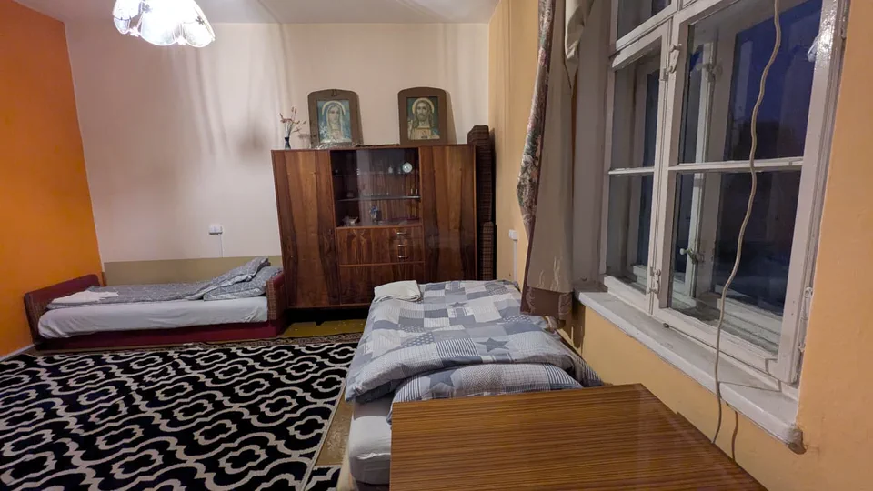 Reference photo of Opposite Right upstairs Room 2, listed with two single beds.