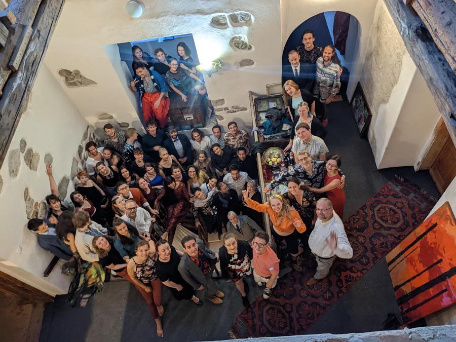 Open Blues participants waving from the palace stairwell